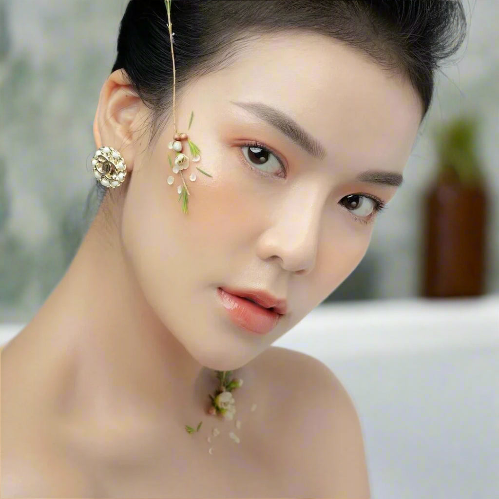 The best face oil for oily skin, asian woman face, hair and scalp oil.