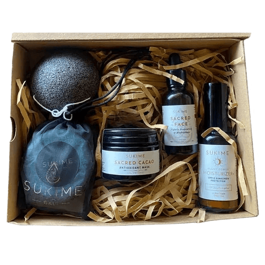 Natural Face Oil, vegan moisturizer with SPF, Cacao  anti-oxidant face mask, and moringa cleaning bar and sponge gift set. 