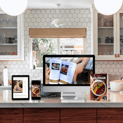 Bali Vegan Book mockup on kitchen counter  with desktop, ipad, iphone and a physical book. 