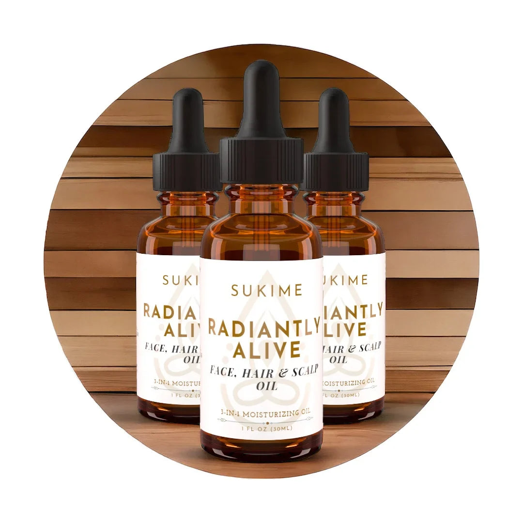 3 bottles of Sukime's Radiantly Alive Oil, a  natural face oil for dry skin, scalp and hair with modern wood background. 